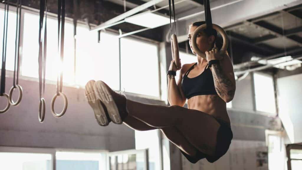 Gymnastic rings being used for suspension training